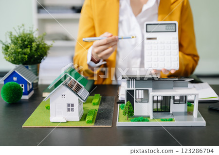 Signing a contract. Client and broker agent, lease agreement, successful deal and Young business sitting at the desk Signing a contract. Client and broker agent, lease agreement, successful deal and Young business sitting at the desk 123286704