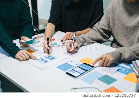 UX graphic designer planning application process development prototype wireframe for web smart phone. 123286737