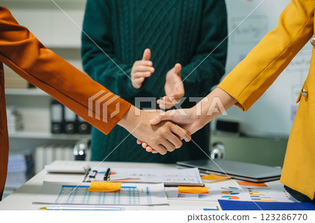 Two confident business man shaking hands during a meeting in the office, success, dealing, greeting and partner Two confident business man shaking hands during a meeting in the office, success, dealing, greeting and partner 123286770