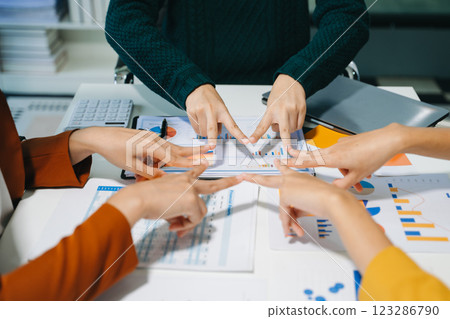 Close up on hands of business people join together their hands together on unity concept 123286790