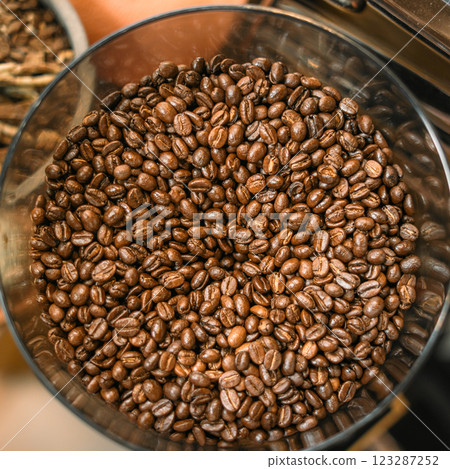 Dark roasted coffee beans, a brown heap of aromatic caffeine grains 123287252