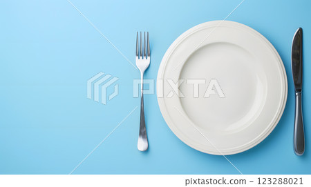 Cutlery, fork, knife, spoon and empty plate on a colored background. AI Generated 123288021