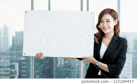 Businesswoman holding a white panel (AI-generated image) Businesswoman holding a white panel (AI-generated image) 123289457
