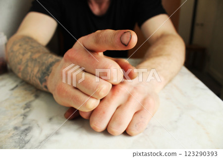 A man points his finger at the screen. Abuser 123290393