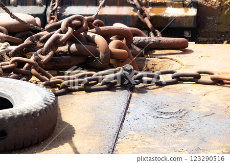 Image of the port scene with chains and tires scattered around Image of the port scene with chains and tires scattered around 123290516