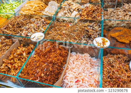 assortment of dried fish and seafood for snacks on counter at Asian fish market in Vietnam 123290676