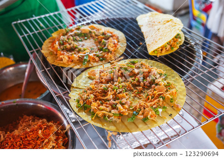 Vietnamese banh Xeo pancakes grilled at Asian street night market in Vietnam. Traditional Vietnamese street food Vietnamese banh Xeo pancakes grilled at Asian street night market in Vietnam. Traditional Vietnamese street food 123290694