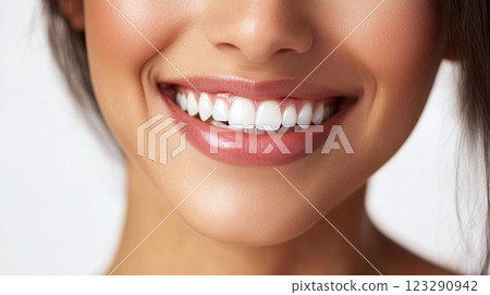 Radiant smile with perfect teeth and pink lips. Portrait of a smiling woman showcasing dental health and beauty. Radiant smile with perfect teeth and pink lips. Portrait of a smiling woman showcasing dental health and beauty. 123290942
