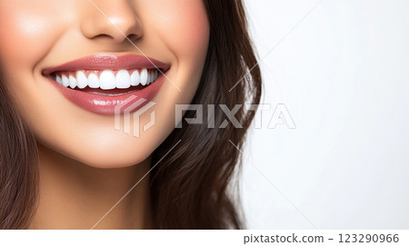 Radiant Smile: Perfect teeth, enhanced with natural makeup, showcases confidence and health. Beautiful lips with glossy lipstick. 123290966