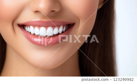 Radiant smile: Close-up captures perfect white teeth and healthy pink lips, showcasing dental hygiene and beauty for a confident look. 123290982