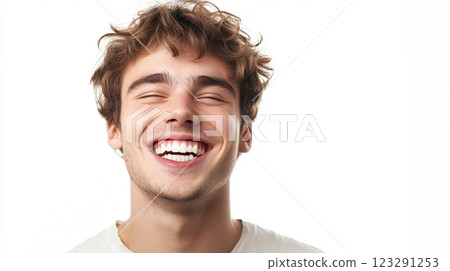 Joyful smile of a young man with curly hair, eyes closed, radiating happiness and positive emotion, against a bright white backdrop. Joyful smile of a young man with curly hair, eyes closed, radiating happiness and positive emotion, against a bright white backdrop. 123291253