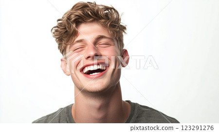 Euphoric Expression: Man laughing with closed eyes conveys joy, happiness, and positive emotions against a clean, bright background. Euphoric Expression: Man laughing with closed eyes conveys joy, happiness, and positive emotions against a clean, bright background. 123291276