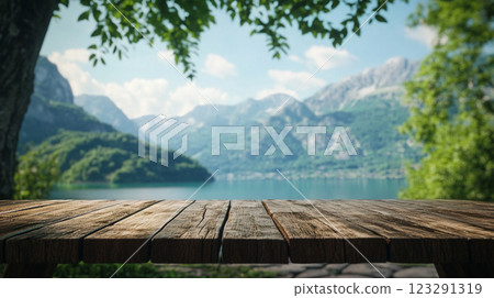 Scenic mountain lake view from a wooden table, perfect for nature lovers seeking tranquility and peaceful landscapes. Summer vibes! #Nature 123291319