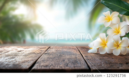 Tropical escape with plumeria blossoms on weathered wood, ocean backdrop. Serene island vibes, perfect for relaxation and vacation dreams. Tropical escape with plumeria blossoms on weathered wood, ocean backdrop. Serene island vibes, perfect for relaxation and vacation dreams. 123291736