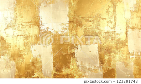 Abstract painting featuring gold and cream brushstrokes creating a textured and luminous surface with a dynamic visual appeal. 123291748