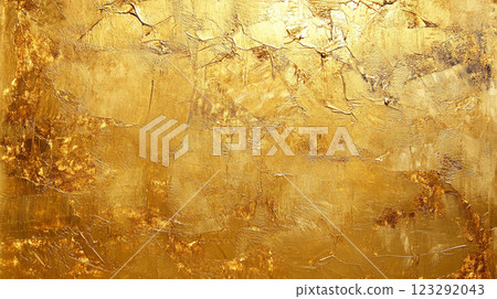Textured gold surface with light and shadow. Abstract painting with uneven surface, cracks, and crevices adding depth and visual interest. 123292043