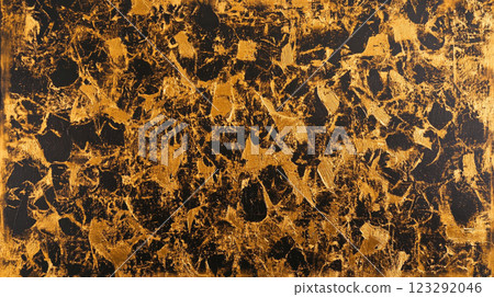 Striking gold and black abstract art piece featuring heavy texture and bold contrast, creating a visually captivating surface. 123292046