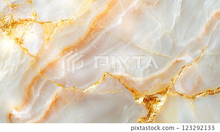Golden Veins on Marble: A luxurious texture with shimmering gold accents enhancing the natural beauty of white and pale orange marble. 123292133