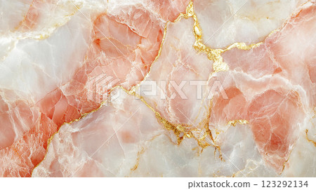 Elegant rose quartz with golden veins creating a luxurious, natural texture. A beautiful and sophisticated stone pattern. 123292134