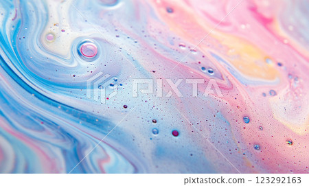 Abstract pastel swirls blend soft pinks and blues in a dreamy, textured composition. Liquid art with subtle bubbles adds depth. 123292163
