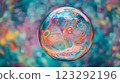 Abstract: A mesmerizing sphere of swirling colors against a softly blurred, vibrant backdrop. Light dances across surface. 123292196