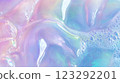 Iridescent swirls of liquid with soft foam details, creating a mesmerizing and abstract visual texture. The pastel hues blend seamlessly. 123292201