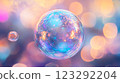 Captivating, iridescent bubble with swirling colors, floats against a blurred backdrop of soft pinks, purples, and blues creating a dreamy effect. 123292204