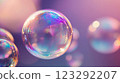Macro photograph capturing the ethereal beauty of iridescent soap bubbles, creating a dreamlike, visually stunning and colorful spectacle. 123292207