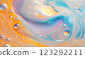Colorful abstract macro featuring water droplets and swirling patterns in blue, orange, and white, creating a vibrant, dreamy aesthetic. 123292211