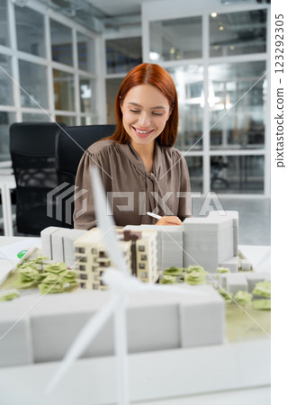 Ginger young woman working in the modern office Ginger young woman working in the modern office 123292305