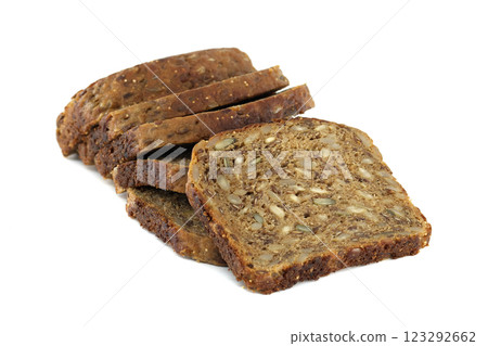 Several slices of dark multigrain bread are stacked, showing off the healthy mix of seeds. Several slices of dark multigrain bread are stacked, showing off the healthy mix of seeds. 123292662