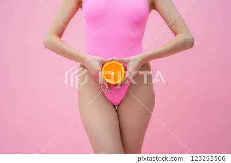 Close up picture of woman holding in hands a part of orange Close up picture of woman holding in hands a part of orange 123293506