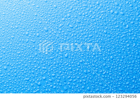 Image of water droplets Blue background 123294056