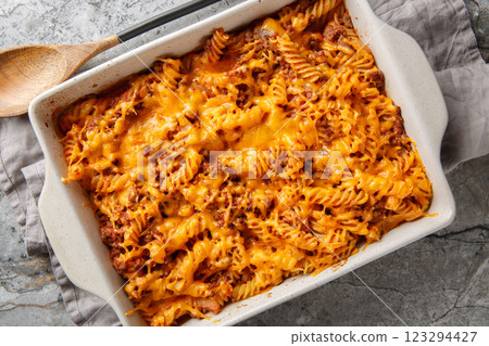 Homemade Sloppy Joe Casserole with ground beef, pasta and gooey cheddar cheese and baked to perfection in the oven closeup in the baking dish. Horizontal top view 123294427