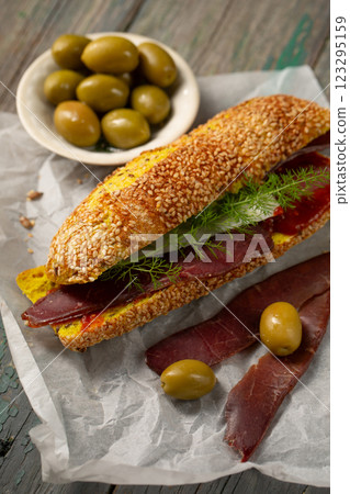 Burger with ciabatta with turmeric and bastrum Burger with ciabatta with turmeric and bastrum 123295159