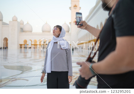 Photographer Capturing a Woman at Sheikh Zayed Grand Mosque in Abu Dhabi 123295201