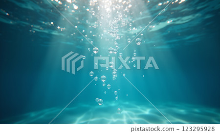 Sunlight reflects on the surface of a clear blue swimming pool. Perfect for conveying summer, relaxation, and vacations. 123295928