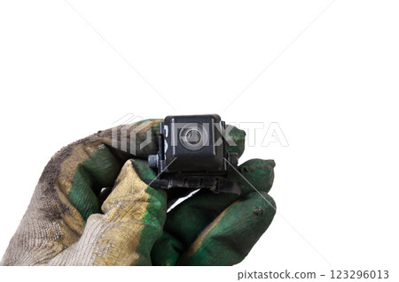 Close-up Interior view with rear view camera in the arm with glove of mechanic. Auto service industry. Safety drive. 123296013