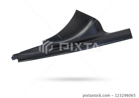 A black plastic decorative door sills in an automobile parsing for sale or repair in a workshop on a white isolated background in a photo studio. 123296065
