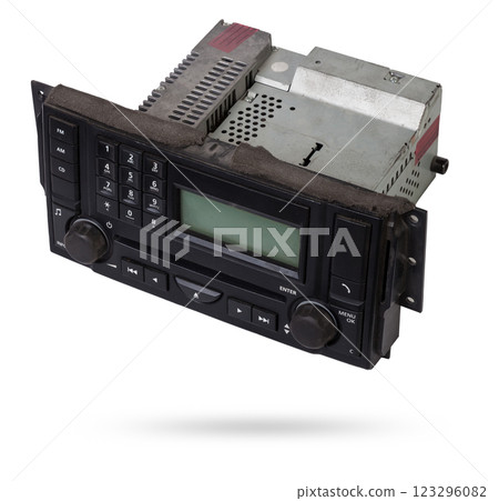 an audio system and a radio in gray and black plastic of car with cd and mp3 music on white isolated background an audio system and a radio in gray and black plastic of car with cd and mp3 music on white isolated background 123296082