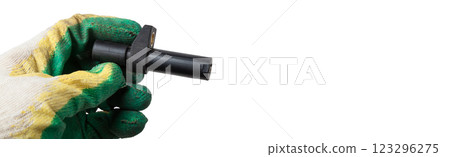 Electromagnetic crankshaft position sensor of a car engine in the hands of an auto mechanic. Spare parts catalog. Electromagnetic crankshaft position sensor of a car engine in the hands of an auto mechanic. Spare parts catalog. 123296275