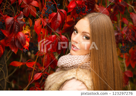 Portrait girl relaxing walking in autumnal park. Portrait girl relaxing walking in autumnal park. 123297276