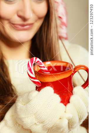 Girl hands holding mug and cane. Girl hands holding mug and cane. 123297450