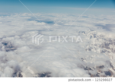 Mountain view with clouds from flying plane Mountain view with clouds from flying plane 123298027