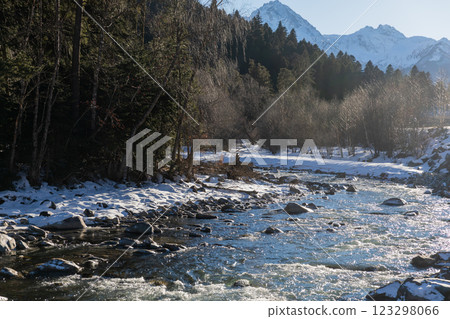 Beautiful landscape, mountain river and snow-covered forest Beautiful landscape, mountain river and snow-covered forest 123298066