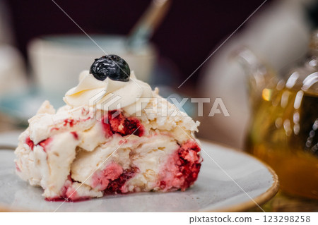 Beautiful delicious cake decorated with blueberries in a cafe - close-up Beautiful delicious cake decorated with blueberries in a cafe - close-up 123298258