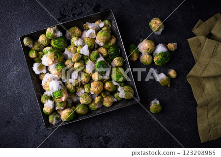 Frozen Brussels sprouts on dark background 123298965