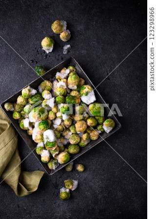 Frozen Brussels sprouts on dark background Frozen Brussels sprouts on dark background 123298966