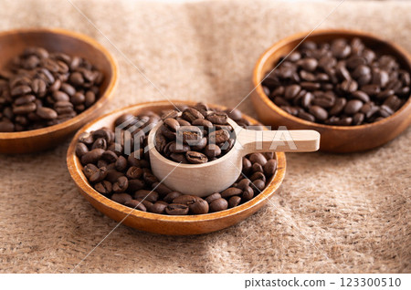 Coffee beans scooped with a spoon 123300510