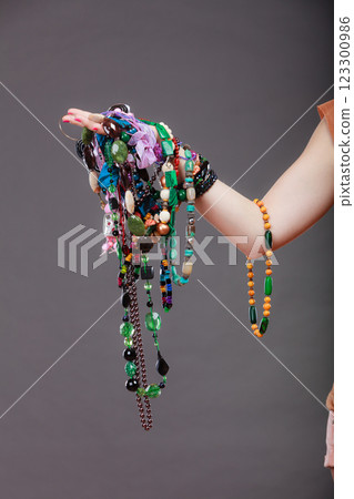Closeup of woman with jewelry necklaces beads. 123300986